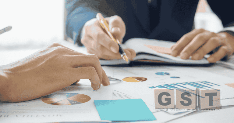 Small business owner reviewing GST compliance documents