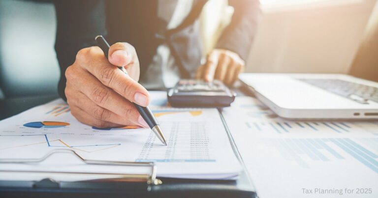 Person reviewing financial documents and using a calculator for 2025 tax planning in India.
